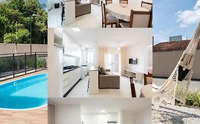 Apartamentos a 150 M DA PRAIA com SACADA, WI-FI, PISCINA, PORTARIA 24h, PLAYGROUND e vaga de GARAGEM